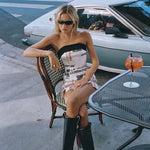 Clarissa - Off shoulder playsuit med avistryk