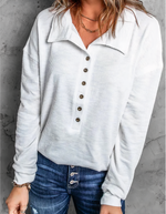 Casual ensfarvet top med knapper