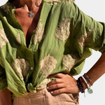 Bluse med trykt revers og knap