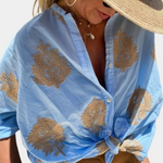 Bluse med trykt revers og knap