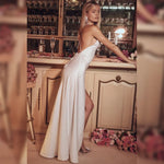 Bella - Elegant maxikjole med halterneck og høj slids