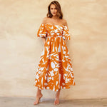 Bianca - Livlig off-the-shoulder midikjole med et geometrisk mønster