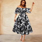 Bianca - Livlig off-the-shoulder midikjole med et geometrisk mønster
