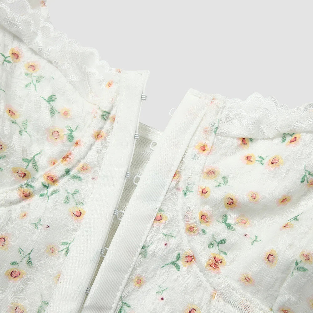 Isabella - Korsettop med blomsterblonde blonder med pufærmer