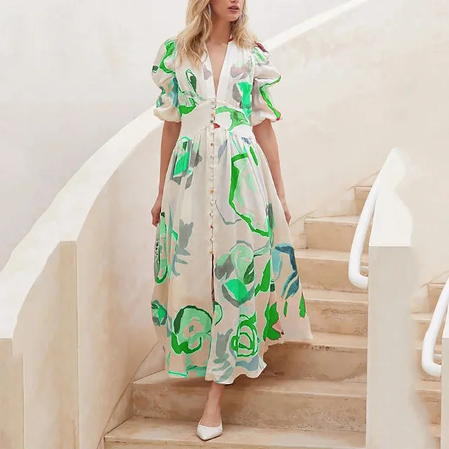 Nina - midikjole med blomsterprint med pufærmer