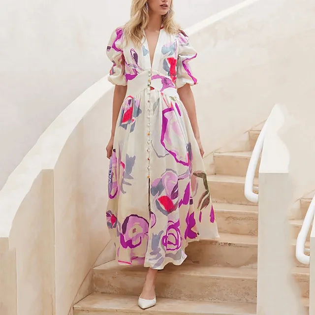 Nina - midikjole med blomsterprint med pufærmer