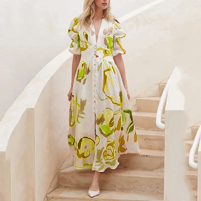Nina - midikjole med blomsterprint med pufærmer