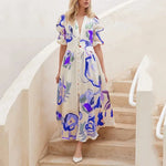 Nina - midikjole med blomsterprint med pufærmer