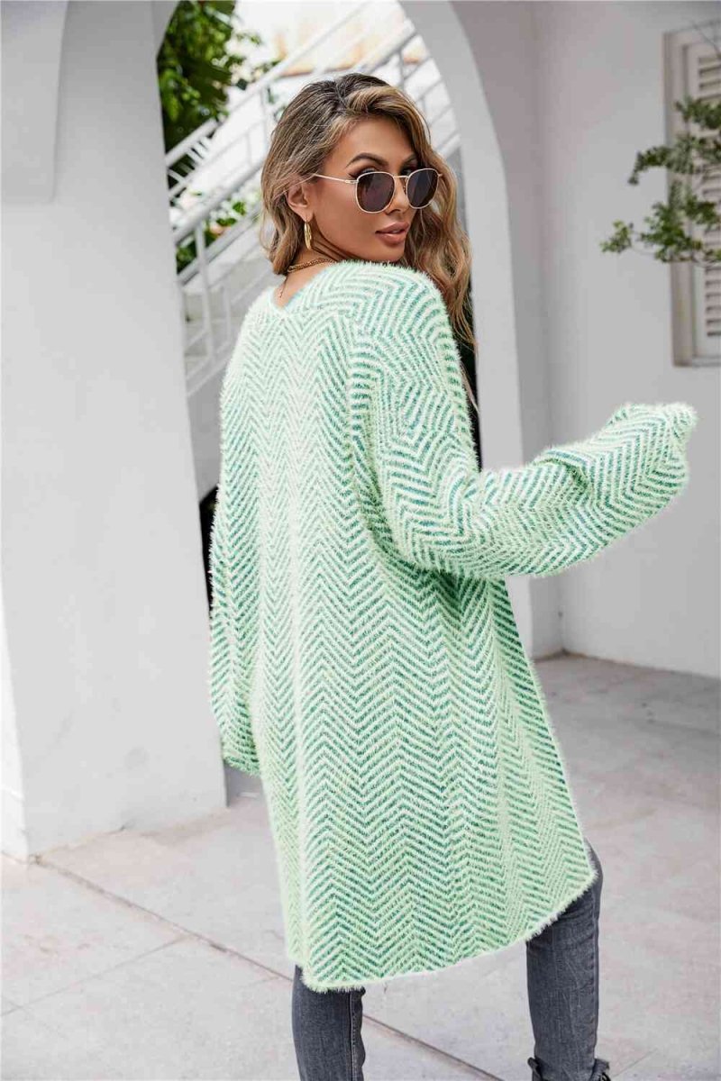 Cardigan med sildebensmønster og vamset pels