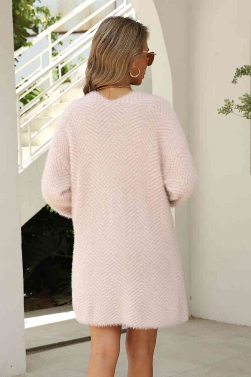 Cardigan med sildebensmønster og vamset pels