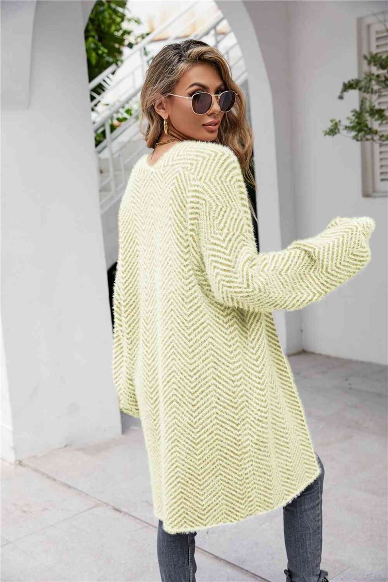 Cardigan med sildebensmønster og vamset pels