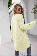 Cardigan med sildebensmønster og vamset pels
