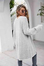 Cardigan med sildebensmønster og vamset pels