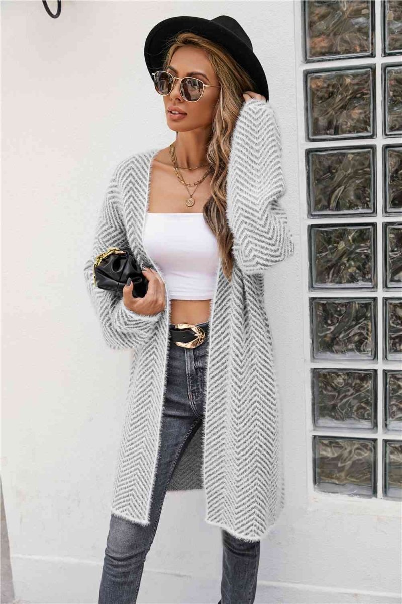 Cardigan med sildebensmønster og vamset pels