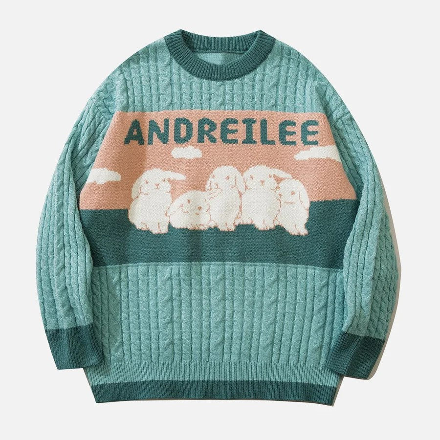 Sabrina - kabelstrikket sweater med pastelsky motiv
