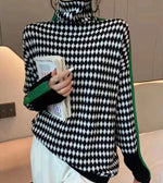 Mia - Elegant sweater med sort og hvidt ternet mønster