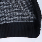 Mia - Elegant sweater med sort og hvidt ternet mønster