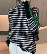 Mia - Elegant sweater med sort og hvidt ternet mønster