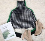 Mia - Elegant sweater med sort og hvidt ternet mønster